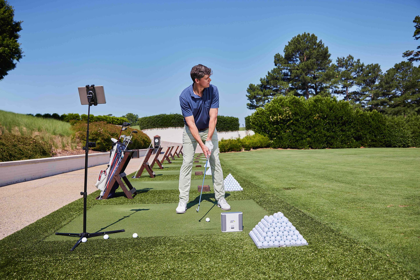 SkyTrak+ Outdoors on Driving Range With Golfer