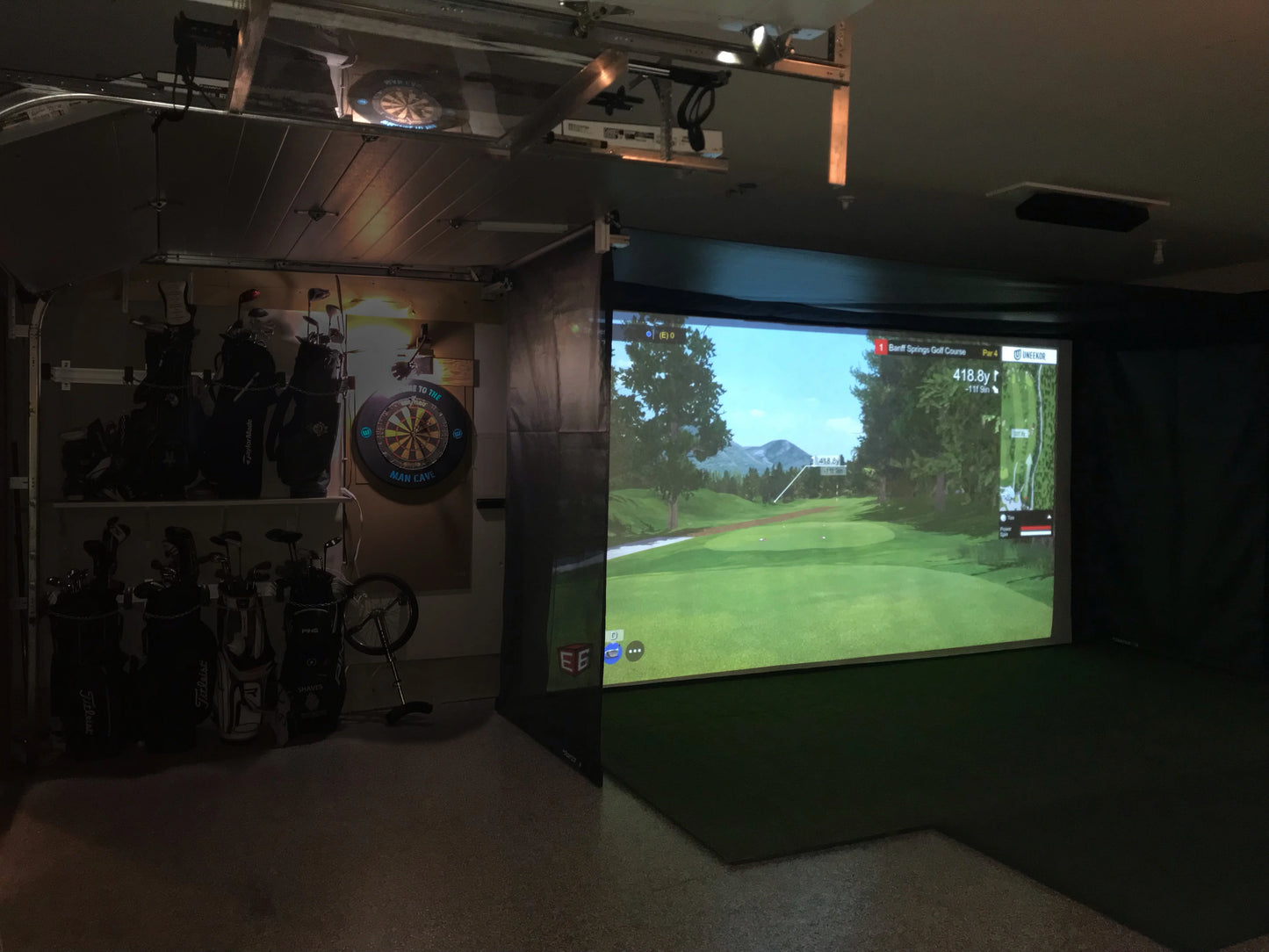 Vanish  Retractable Golf Simulator Screen and Enclosure In A Garage