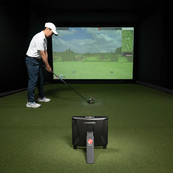 Indoor simulator with FlightScope X3C behind golfer