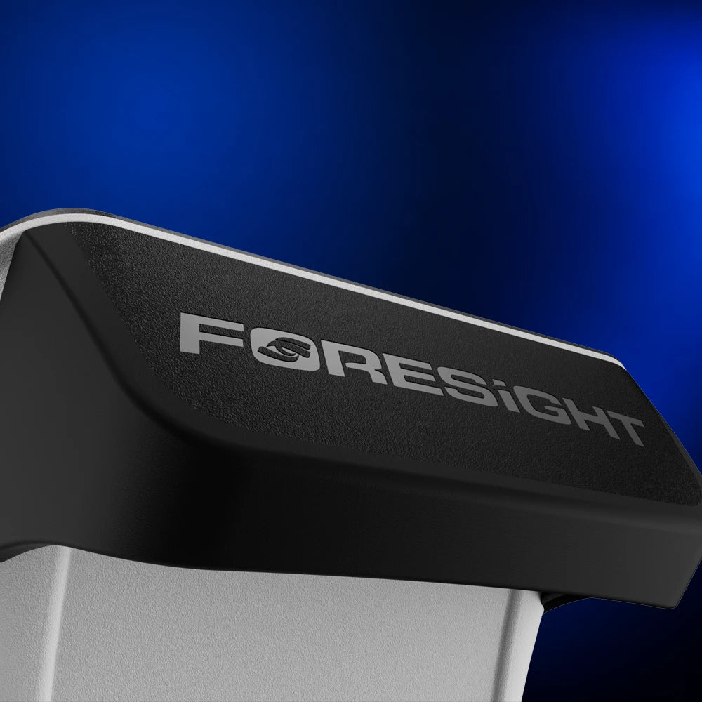 Close-up of the GC2 golf simulator black handle with a silver Foresight logo printed on the black textured surface, set against a dark blue gradient background.