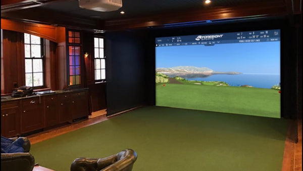 Custom Home Golf Simulator with Hard Wood floors, cherry cabinets and leather seating