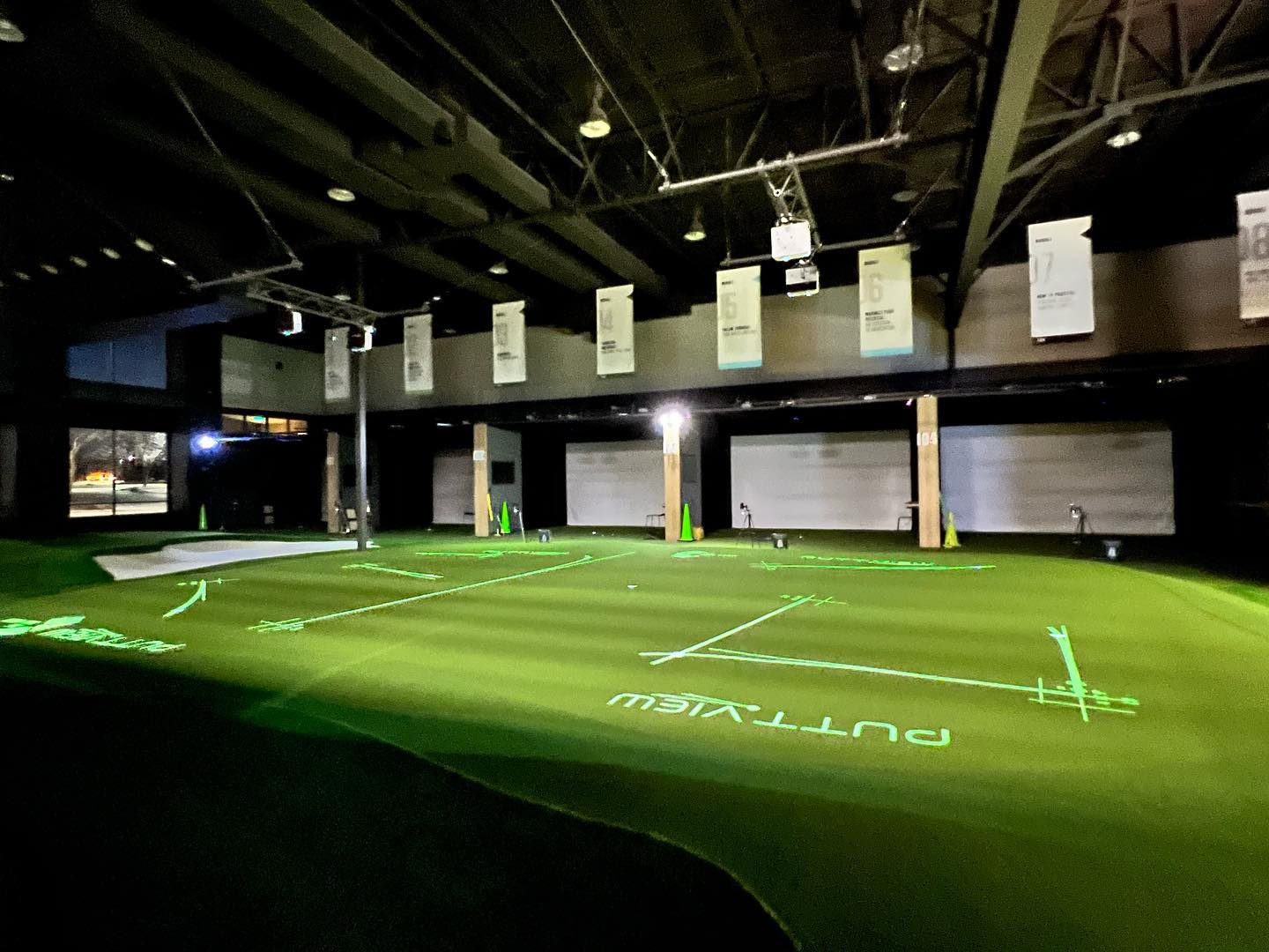 The golf Room Hitting bays.