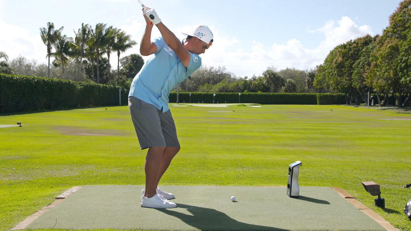 Rickie Fowler hitting balls with GC Quad Launch Monitor.