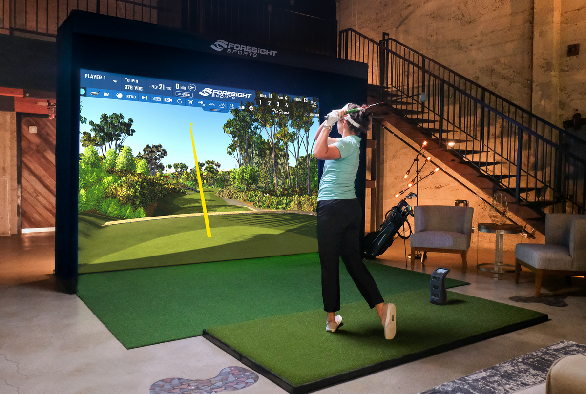 Sim-In-A-Box Birdie Golf Simulator Package Lady Teeing Sample.